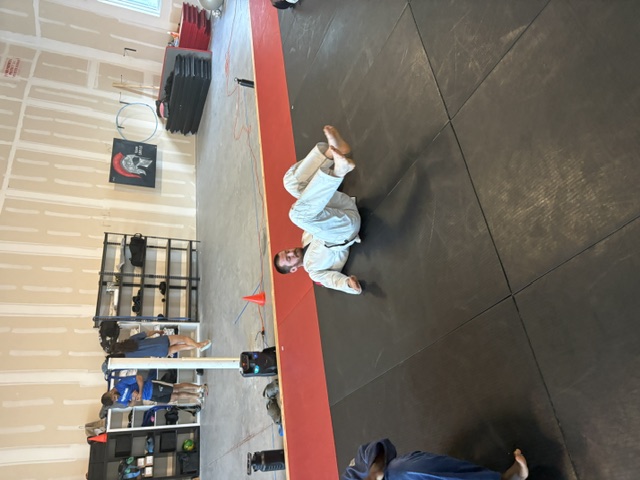 Student at Brevard Judo Academy doing a back fall