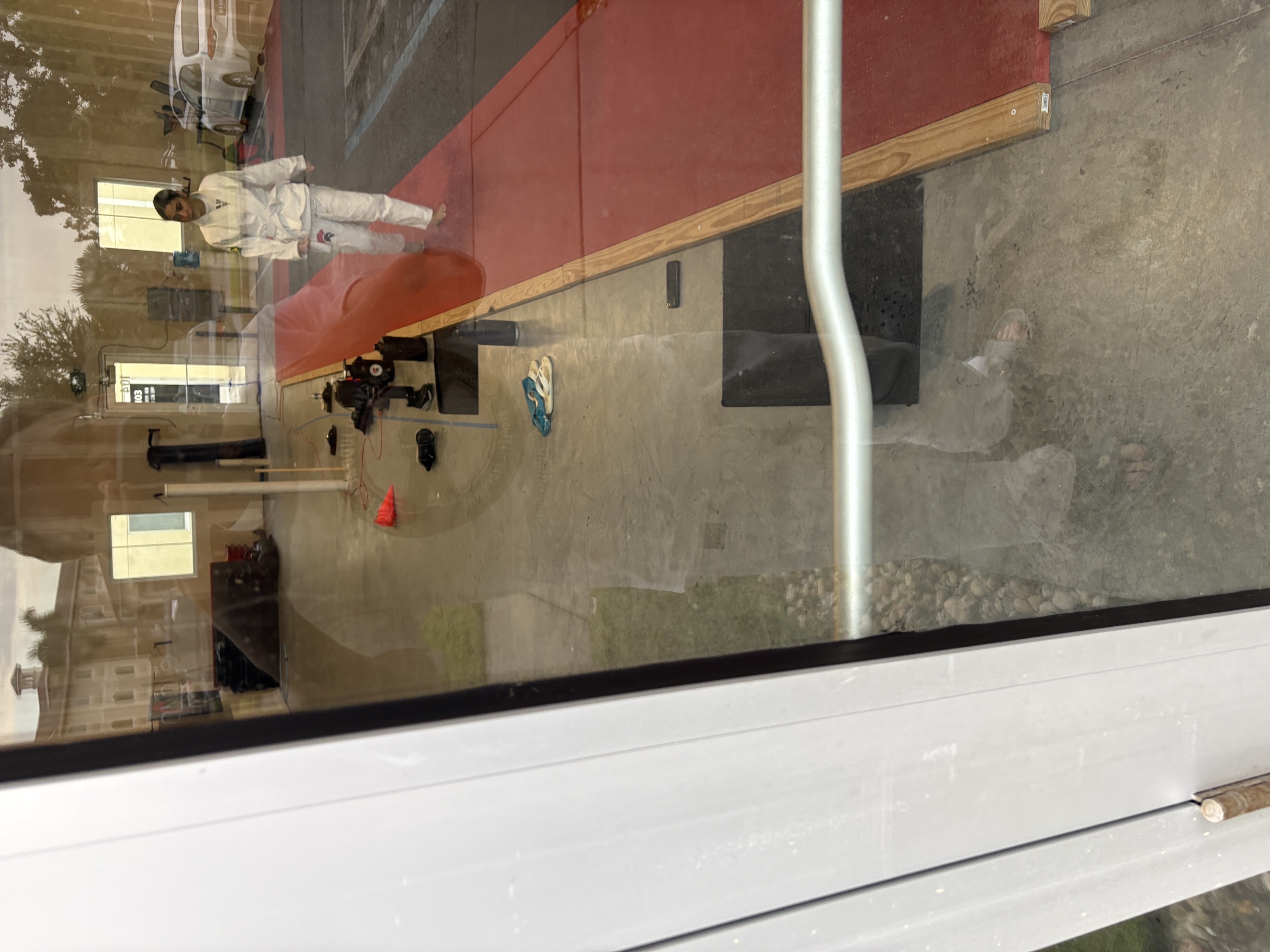 Possible judo student looking in through the front door at Team Camilo/Brevard Judo Academy.